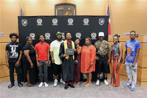 Graduate surrounded by family